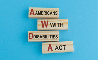 Blue background with blocks spelling Americans With Disability Act