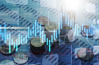 Coins sitting on financial graph